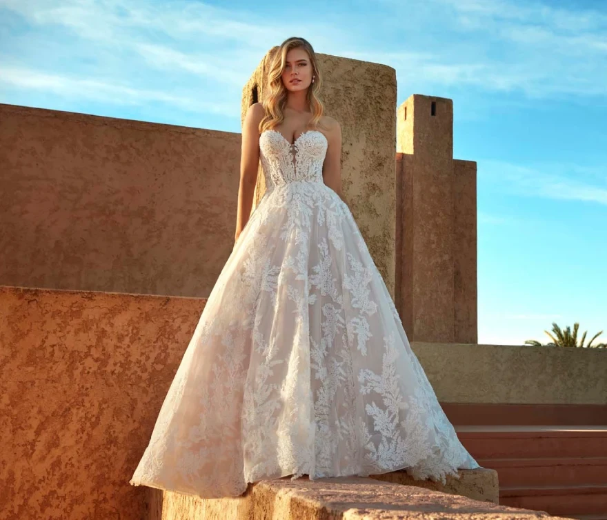 Model wearing a gown by Madison James.